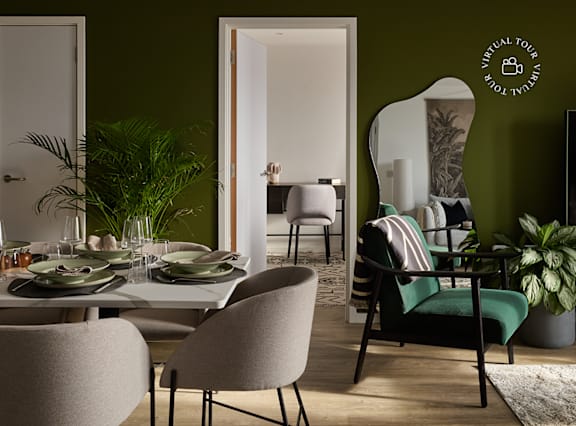 a living room and dining room with a table and chairs