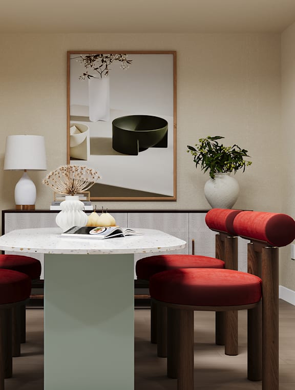 A white living room with a couch, a table, a plant, and a chandelier.