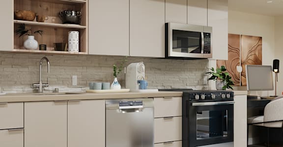 A modern kitchen with a stainless steel dishwasher and oven.