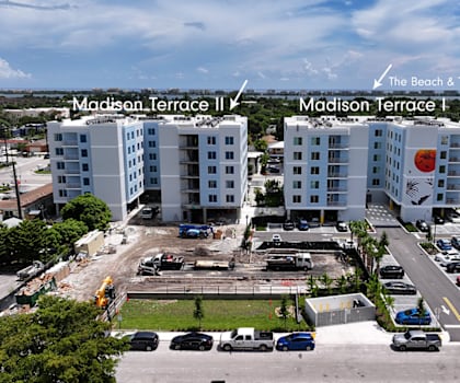 A parking lot with two buildings labeled Madison Terrace I and Madison Terrace II.