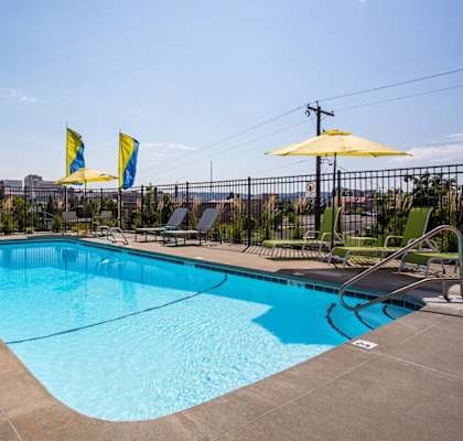 Altura Apartments in Spokane, Washington Pool with Lounge Chairs and Views