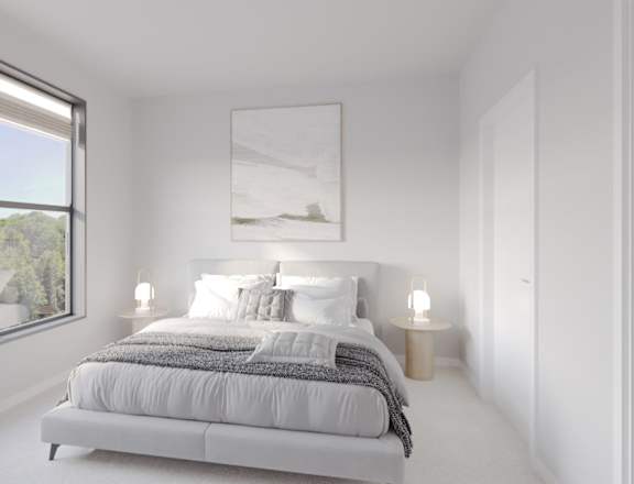 A bedroom with a large bed and a painting on the wall.