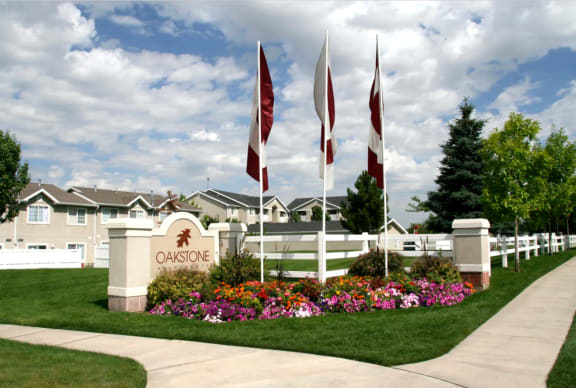 the entrance to a clubhouse with flags in front of it