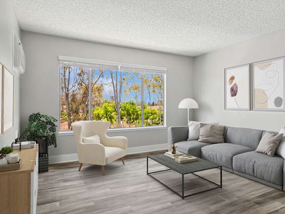 Model Living Room with Wood-Style Flooring and Window View at Fullerton Hills Apartments located in Fullerton, CA-LRGAM.