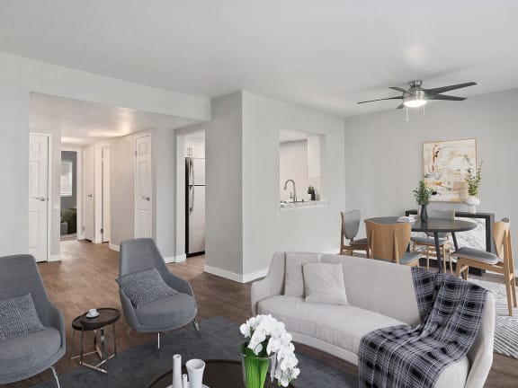Model Living Room and Kitchen with Wood-Style Flooring at Overlook Apartments located in Salt Lake City, UT-LRGAM.