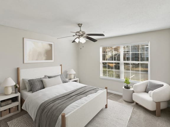 Model Bedroom with Carpet and Window View at Shadow Ridge Apartments in Riverdale, GA-LRGAM.