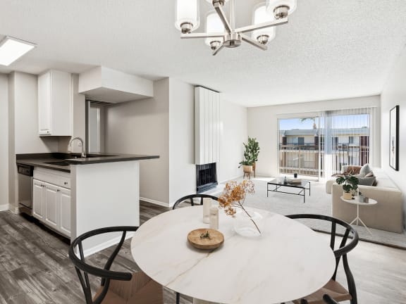 Model Dining Room with Wood-Style Flooring at Madison Park Apartments located in Anaheim, CA-LRGAM.