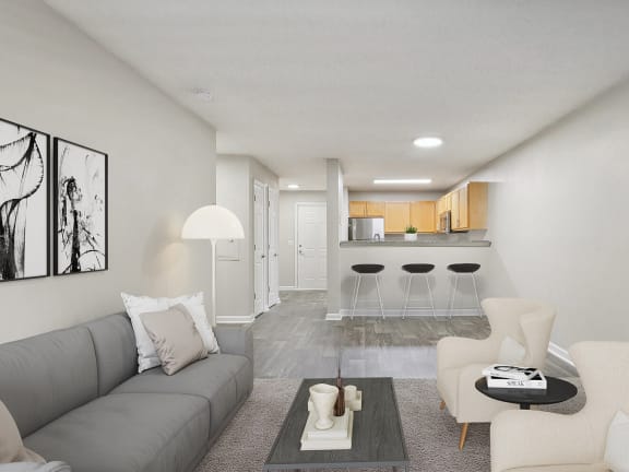 Model Living Room with Carpet and View of Kitchen at Retreat at Stonecrest Apartments located in Lithonia, GA-LRGAM.