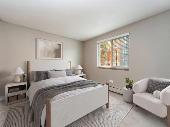 Model Bedroom with Carpet and Window View at Esprit Cherry Creek Apartments in Glendale, CO-LRGAM.
