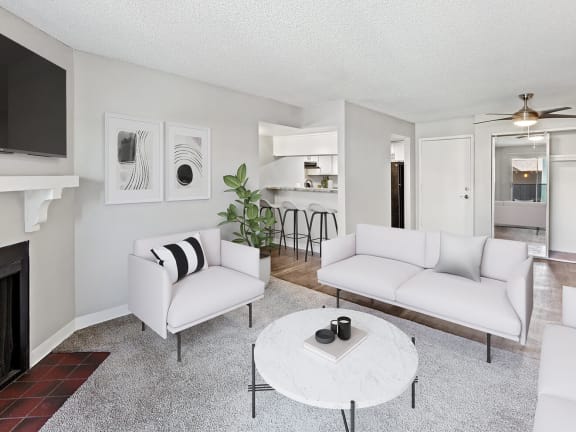 Model Living Room with Wood-Style Flooring at Tanque Verde Apartments located in Tucson, AZ-LRGAM.