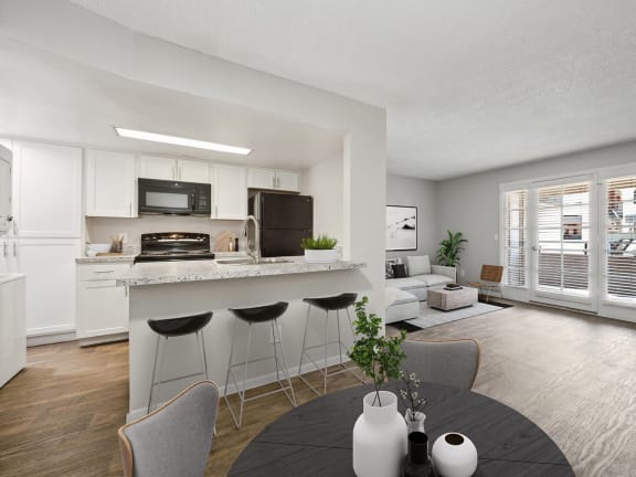 Model Dining Room and Kitchen with Wood-Style Flooring at Country Club Verandas Apartments located in Mesa, AZ-LRGAM.