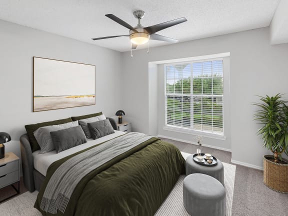 Model Bedroom with Carpet and Window View at Cobblestone Apartments in Arlington, TX-LRGAM.