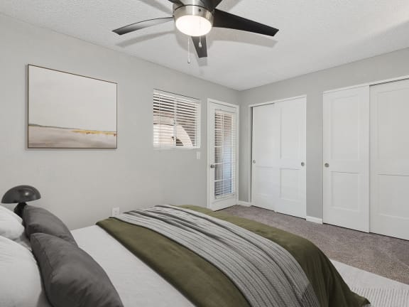 Model Bedroom with Carpet and Double Closets at Stillwater Apartments in Glendale, AZ-LRGAM.