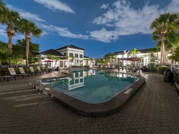 Community Swimming Pool with Pool Furniture at Rosehill Preserve Apartments located in Orlando, FL-LRGAM.