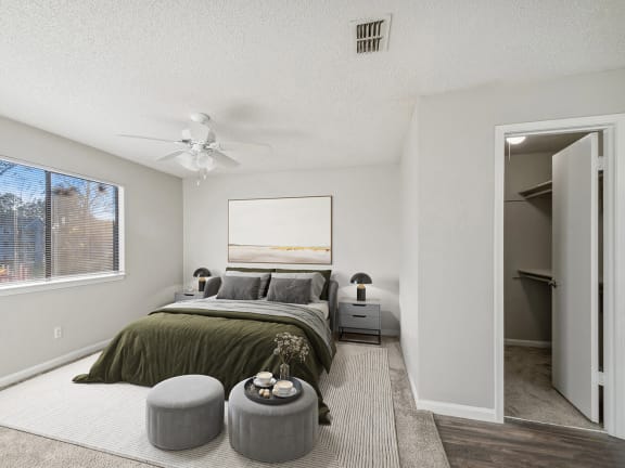 Model Bedroom with Carpet and Walk In Closet at Westland Park Apartments in Jacksonville, FL-LRGAM.