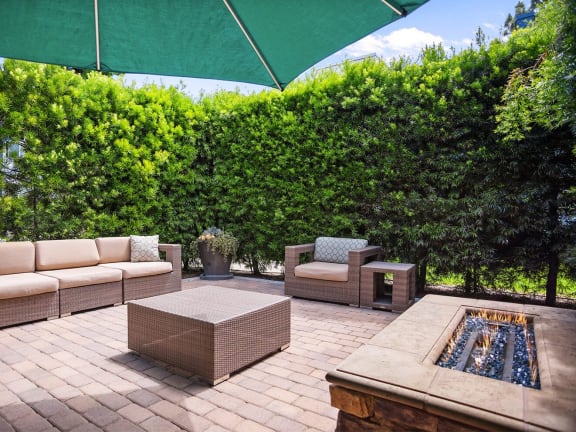 Outdoor patio and gas fireplace at Cover La Mesa
