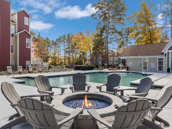 our apartments have a large pool and fire pit with chairs