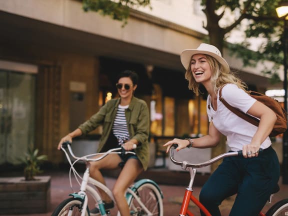 Stock Photo of Two Women Riding Bikes-LRGAM.