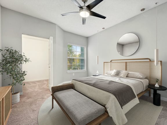 Model bedroom at The Vinings at Hunter's Green Apartments in Tampa, Florida