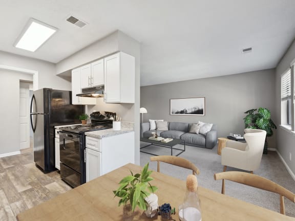 Model Kitchen with White Cabinets and Wood-Style Flooring at Spring Forest Apartments in Raleigh, NC-LRGAM.