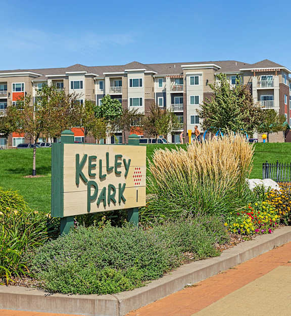 a sign with an apartment building in the background at Gabella at Parkside, Minnesota, 55124
