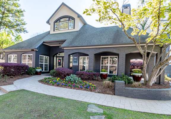 a home with a front yard and a sidewalk
