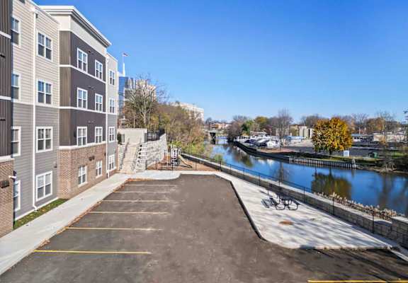 a view of a river with a building and a boat dock