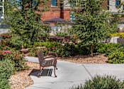 Thumbnail 35 of 36 - a bench sitting on a sidewalk in front of a building at City View St. George, St. George, UT, 84770