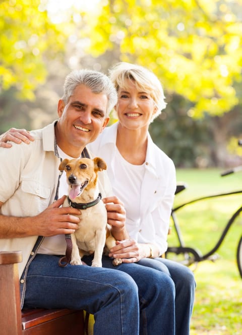 Couple with pet at The Legends at Silver Lake Village 55+ Apartments, St. Anthony, Minnesota