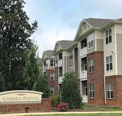 an apartment building with a sign pointe