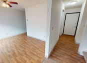 Thumbnail 10 of 19 - Dining room on the left and hallway on the right with wood flooring