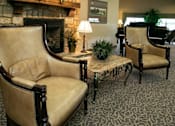 Thumbnail 8 of 11 - Two chairs and a table in a room.