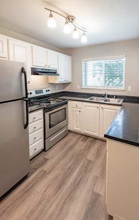 a kitchen and living room in a 555 waverly unit
