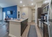 Thumbnail 14 of 24 - Model Kitchen Living Room at Seleno at Bridge Street, Huntsville, Alabama