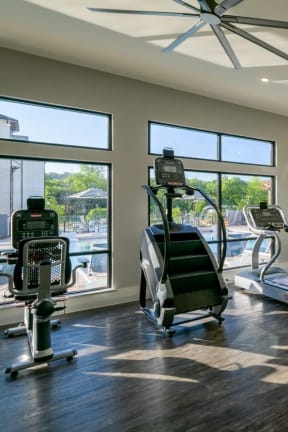 a gym with treadmills and other exercise equipment at The Eddy at Riverview, Smyrna, GA, 30126