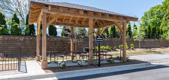Sky Harbor Apartments in Chamblee, GA photo of a pavilion with a grill and picnic tables