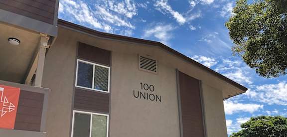a building with a sign that reads 100 union