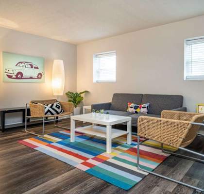 a living room with a couch and a coffee table at Viceroy Apartments, Durham , 27707