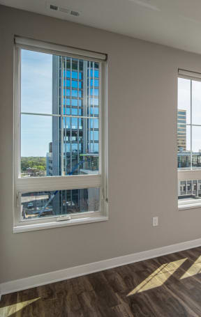 Living room with a view of the city at Dillard Apartments in Fargo, ND 58102