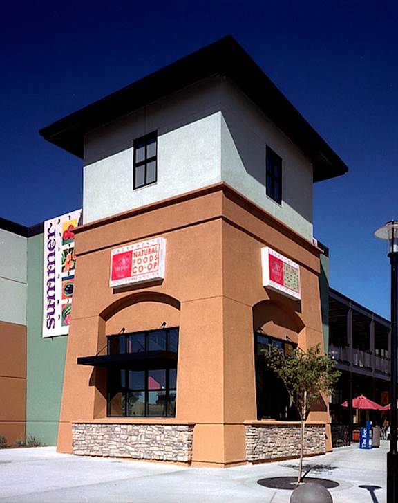 A building with a red sign that says "Joe's Crab Shack" on it.