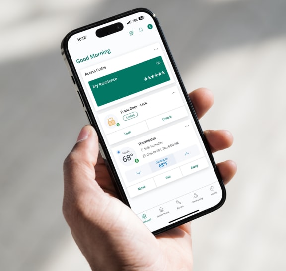 a hand holding a iphone with the costumo payments application on the screen at Lake in the Pines Apartments in Fayetteville, NC