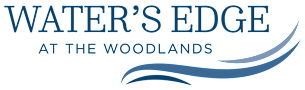 water edge at the woodlands logo with a blue wave