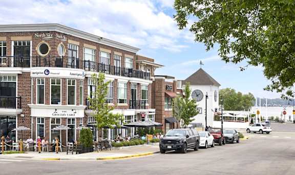 A street view of a town with a building that has a sign that says "Northside".
