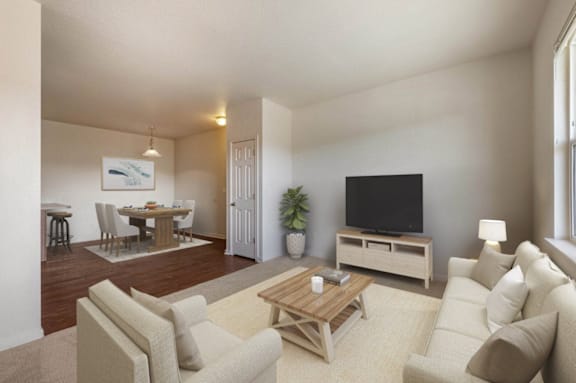 A living room with a wooden coffee table and beige couches.