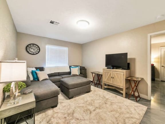 a living room with a couch and a tv