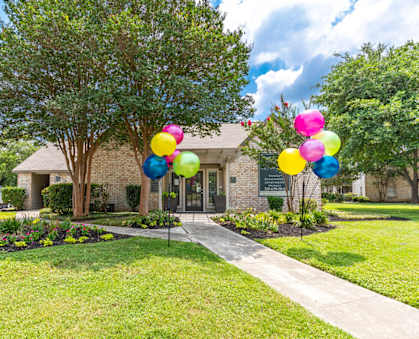 a house with balloons in front of it