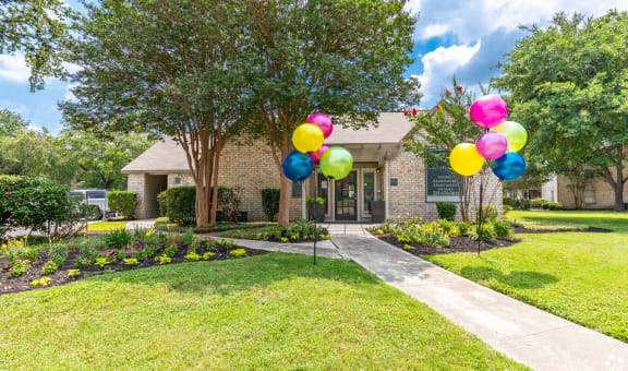 a house with balloons in front of it