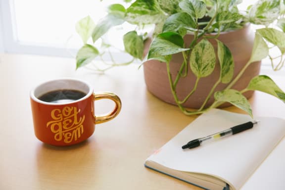 planner_with_pen_and_coffee_cup at Sumida Gardens Apartments, Santa Barbara, CA