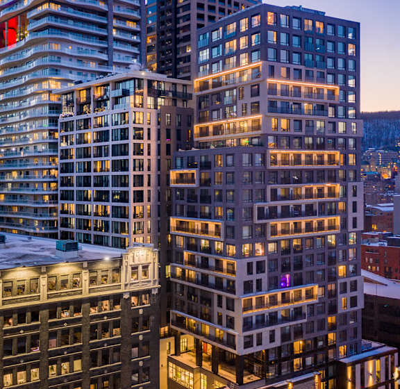 a view of a building on a city street at dusk