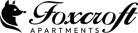 The image is a logo for Foxcroft Apartments, featuring a stylized fox head to the left of the text.
